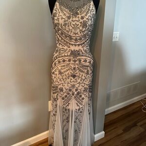 Beautiful light gray evening gown with pewter accents.
